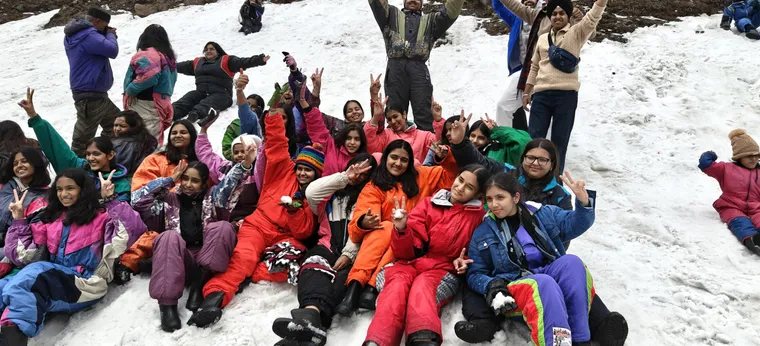 Students participating in a supervised outdoor adventure activity with Marvel Adventures