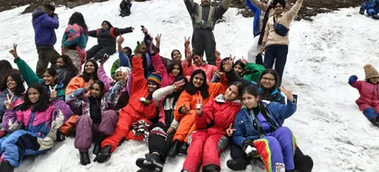 A school group in the snow on a Himalayan tour near Manali